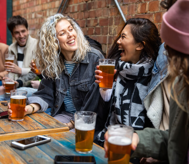 Graduates enjoying a drink together while playing Treasure Hunt Bristol