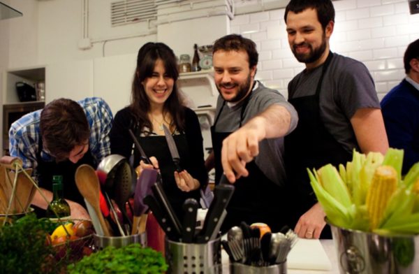 4 people having fun cooking together