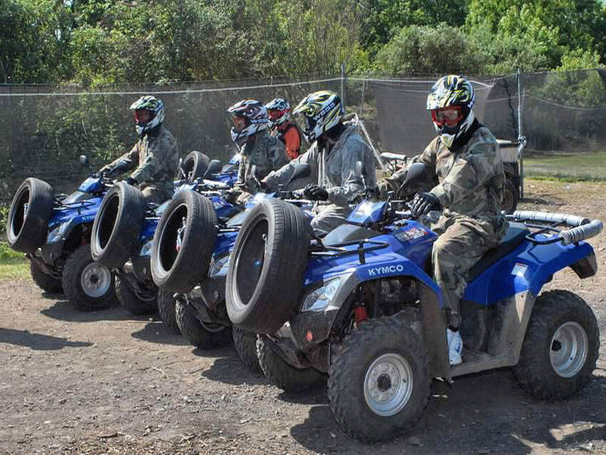 A group of people on quad bikes
